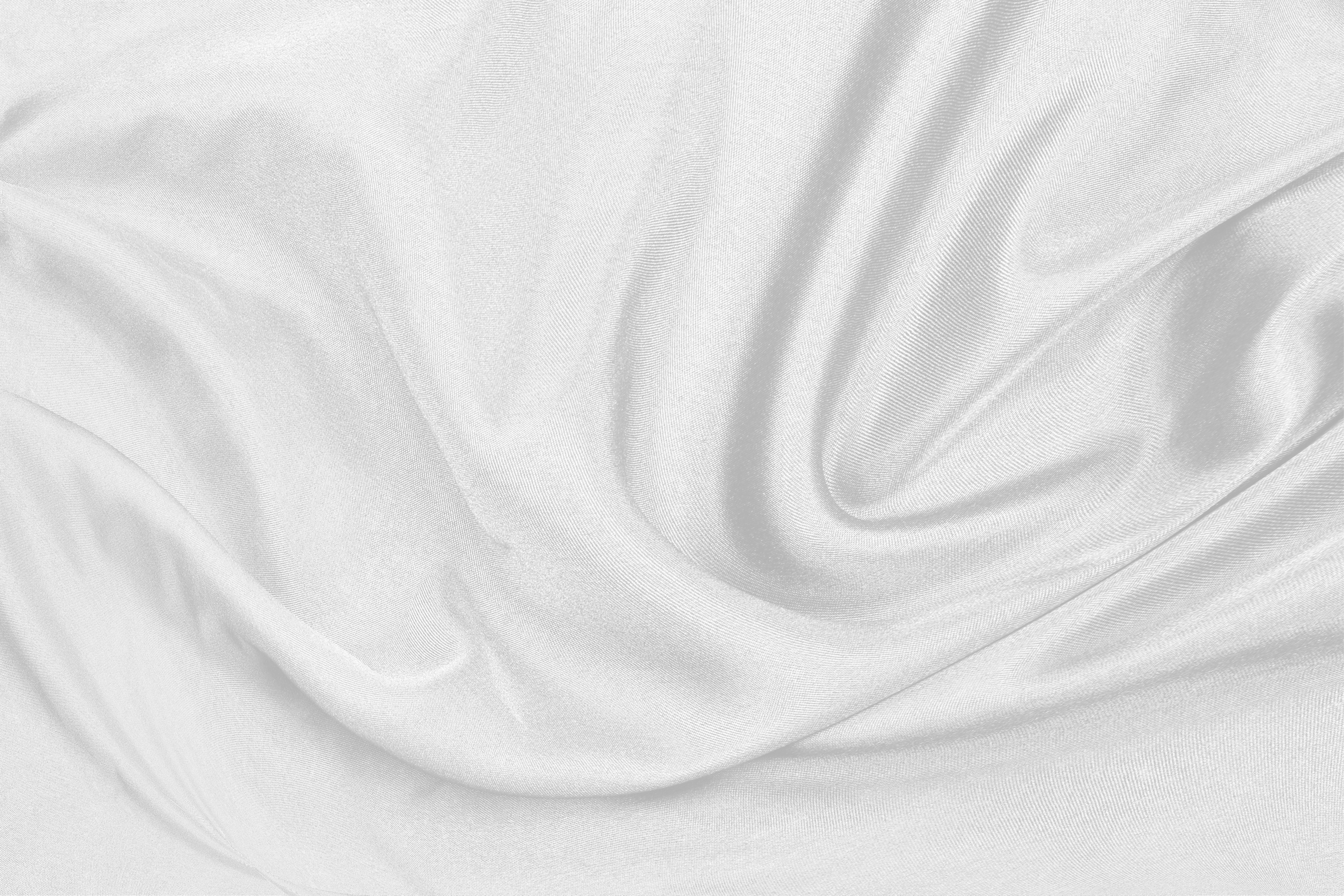 Smooth elegant white silk fabric or satin luxury cloth textu